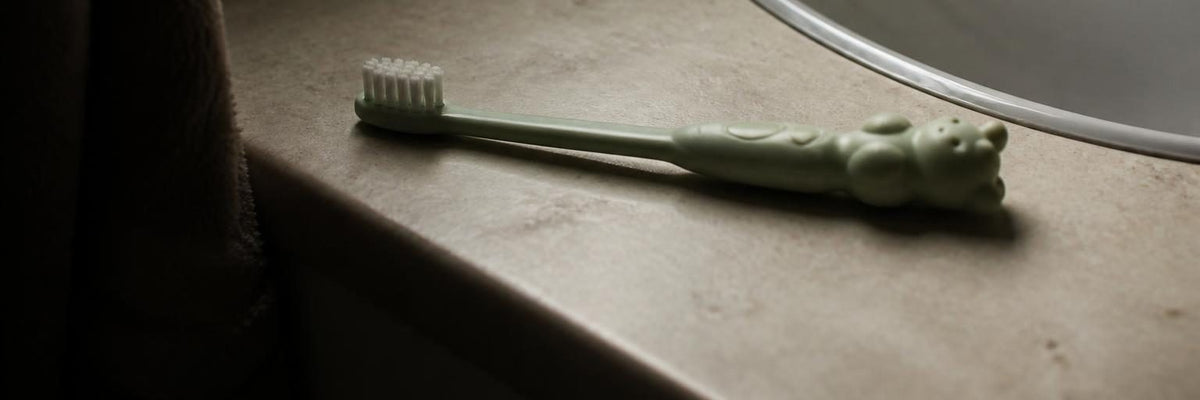 What causes brown or white marks on toddler front teeth?